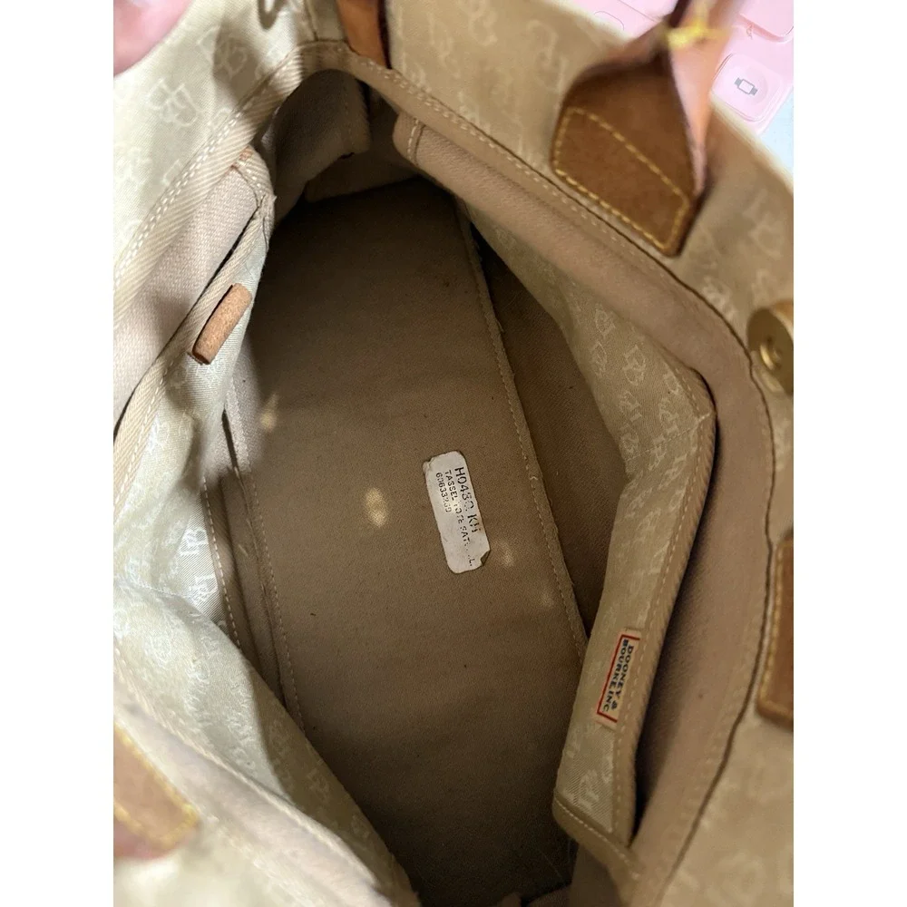 Dooney and Bourke Beige Canvas and Leather Signature Tassel Tote Handbag‎